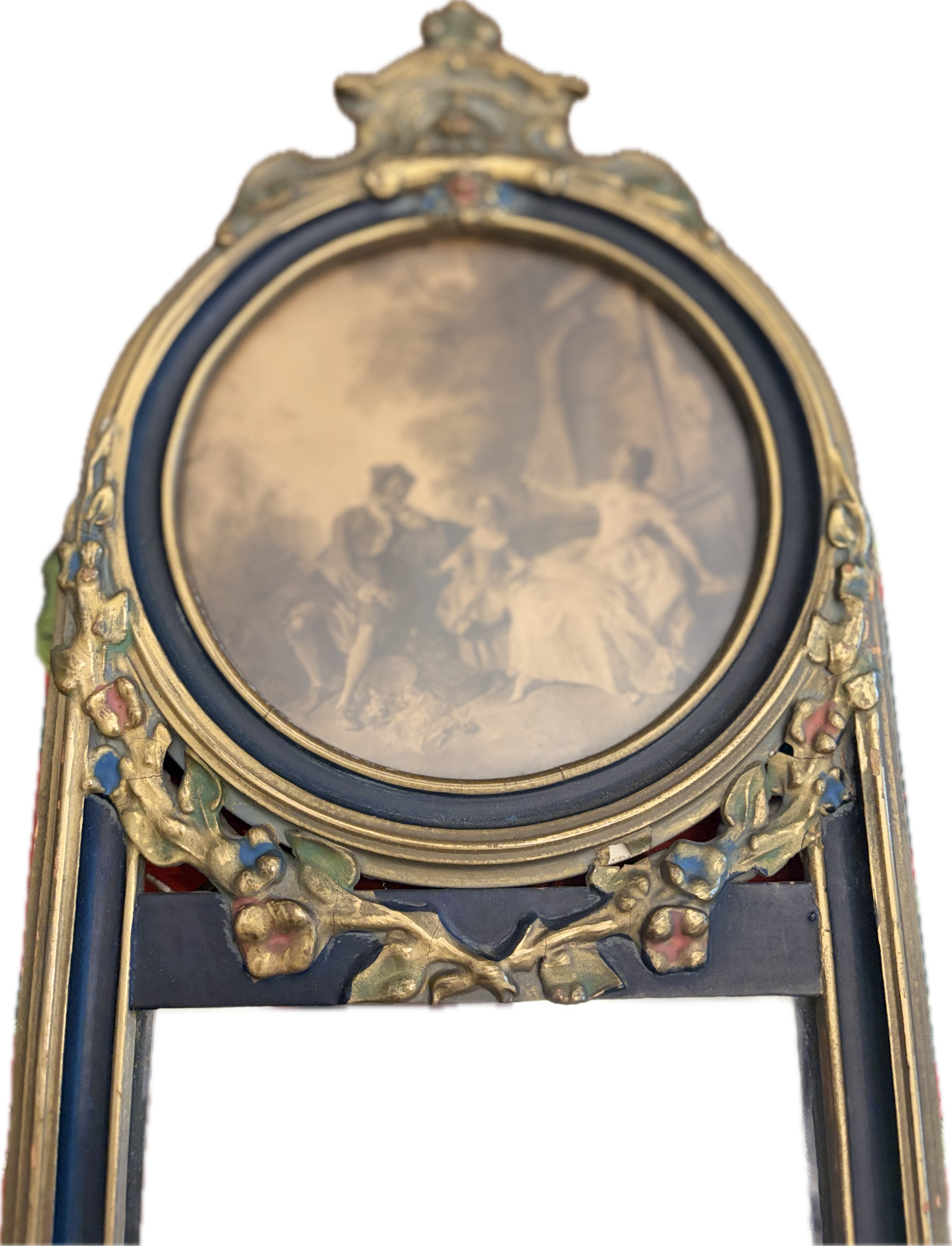 Antique oval-topped decorative mirror with an inset print and ornate frame.