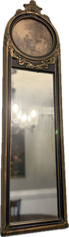 Antique oval-topped decorative mirror with an inset print and ornate frame.