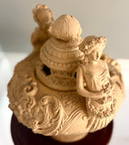 Late 19th–Early 20th Century French Clay Covered Urn with Figural Bust Handles