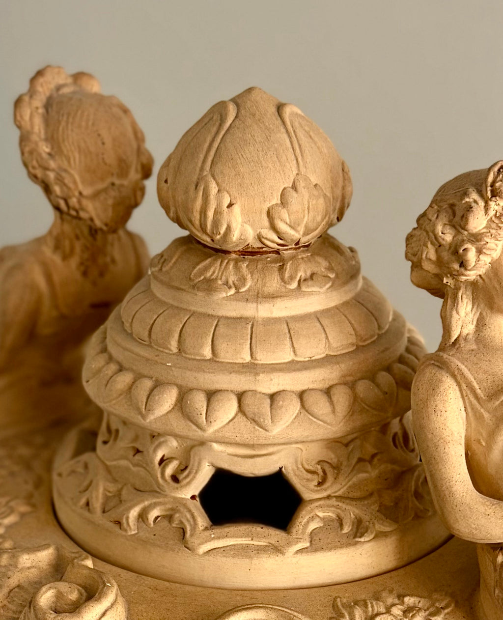 Late 19th–Early 20th Century French Clay Covered Urn with Figural Bust Handles