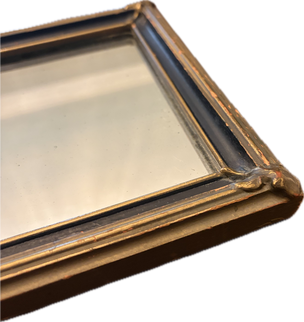 Antique oval-topped decorative mirror with an inset print and ornate frame.