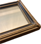 Antique oval-topped decorative mirror with an inset print and ornate frame.